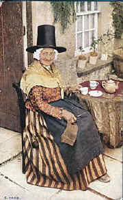 welsh lady taking tea in the traditional costume of Wales 